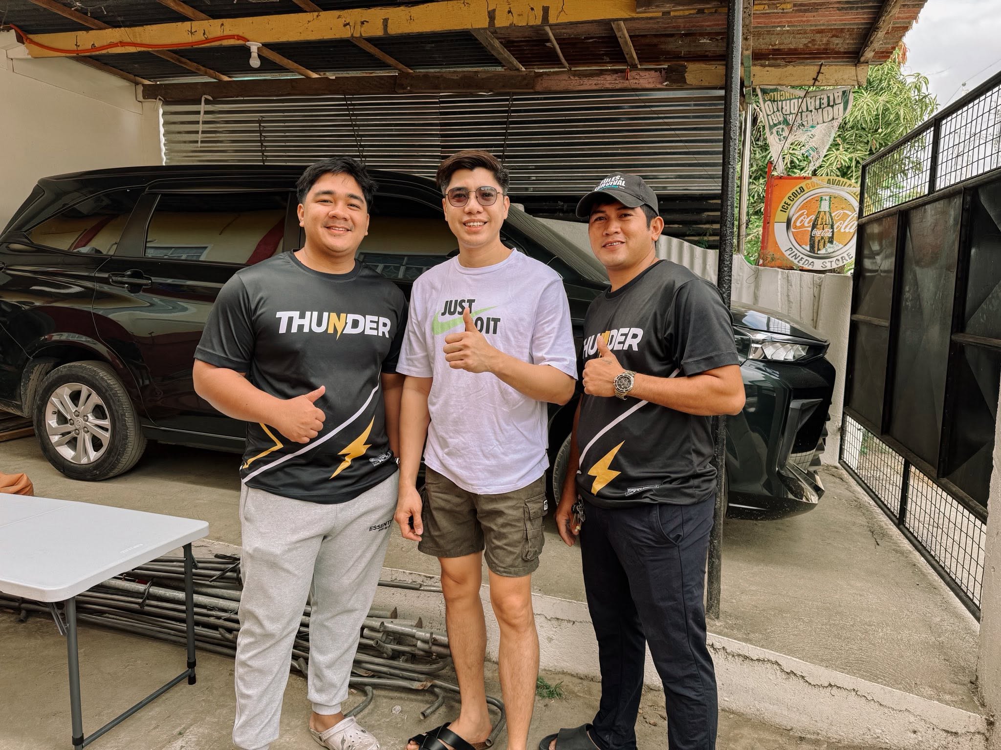 Thunder Auto Hub team detailing a car on-site